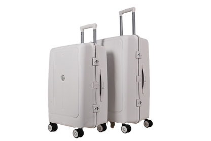 Two hard-shell spinner suitcases in a light warm gray or off-white color, shown on a plain white background. The smaller suitcase is in front of the larger one, both with telescoping handles extended.