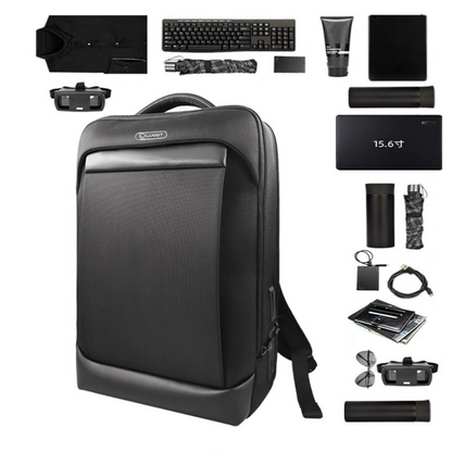Black backpack with various travel items on a white background