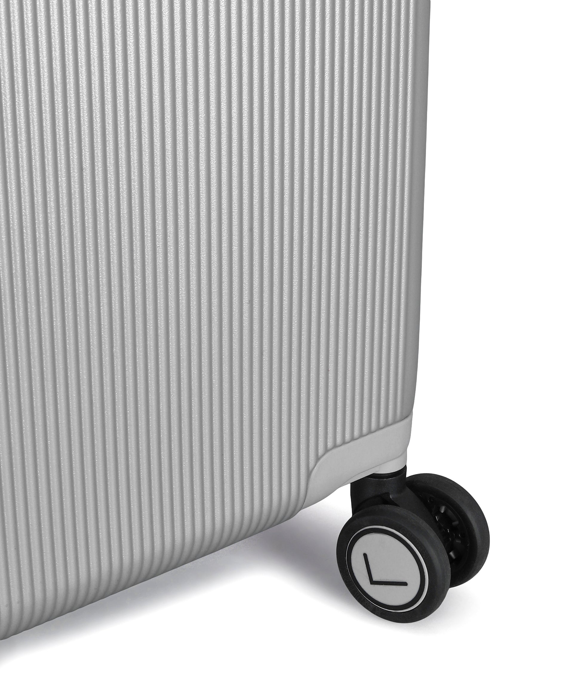 Close-up of a suitcase wheel on a white background
