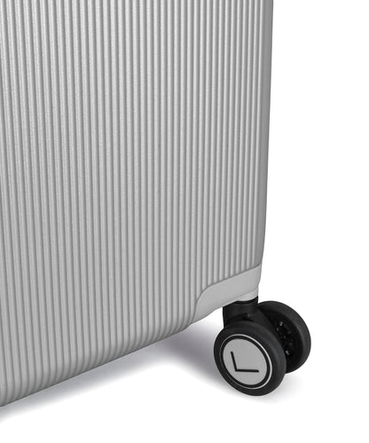 Close-up of a suitcase wheel on a white background