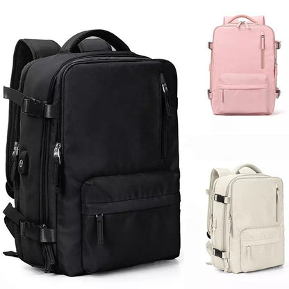 Black, pink, and beige backpacks on a white background