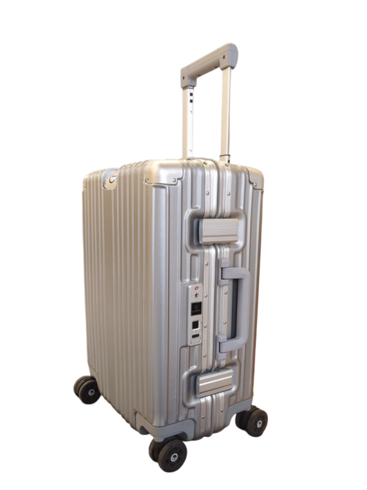 Silver suitcase with wheels on a white background