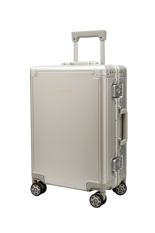 Silver suitcase with wheels on a white background
