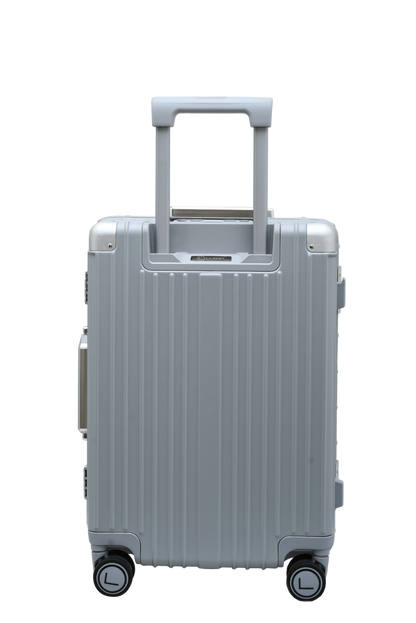 Silver suitcase with a ribbed texture on a white background luggit