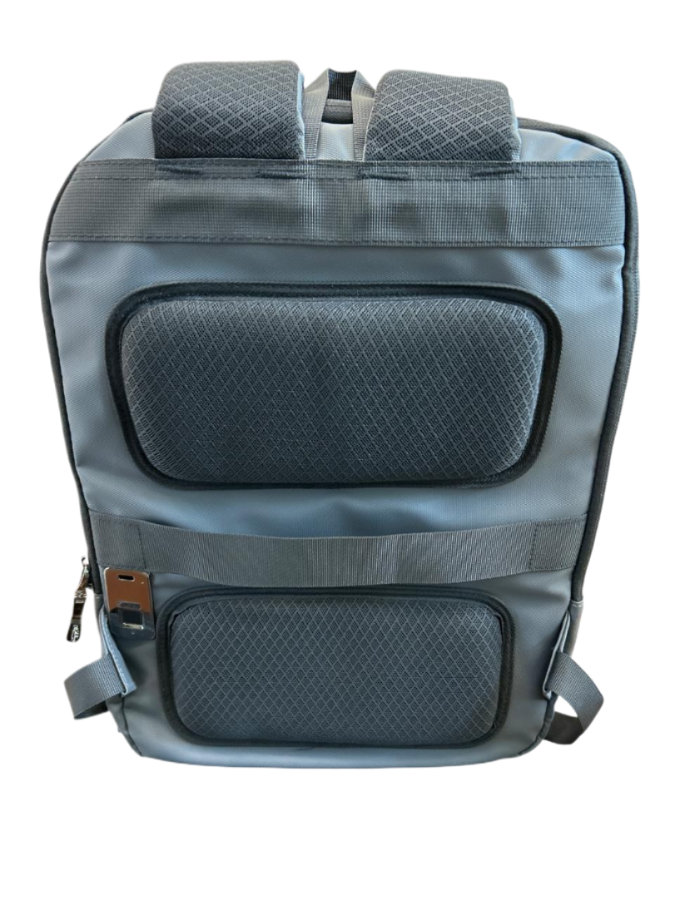 Gray backpack with quilted design on a luggit
