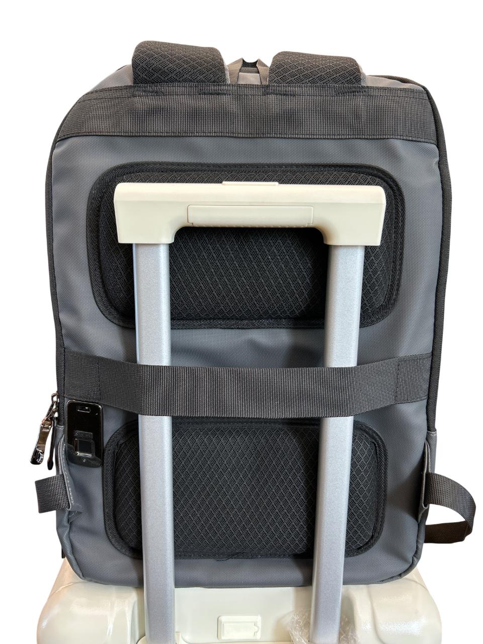 Gray backpack with a built-in handle and wheels on a white background