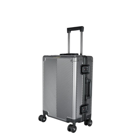 Silver suitcase with black wheels and handle on a white background