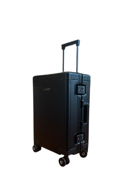 Black suitcase with wheels on a white luggit