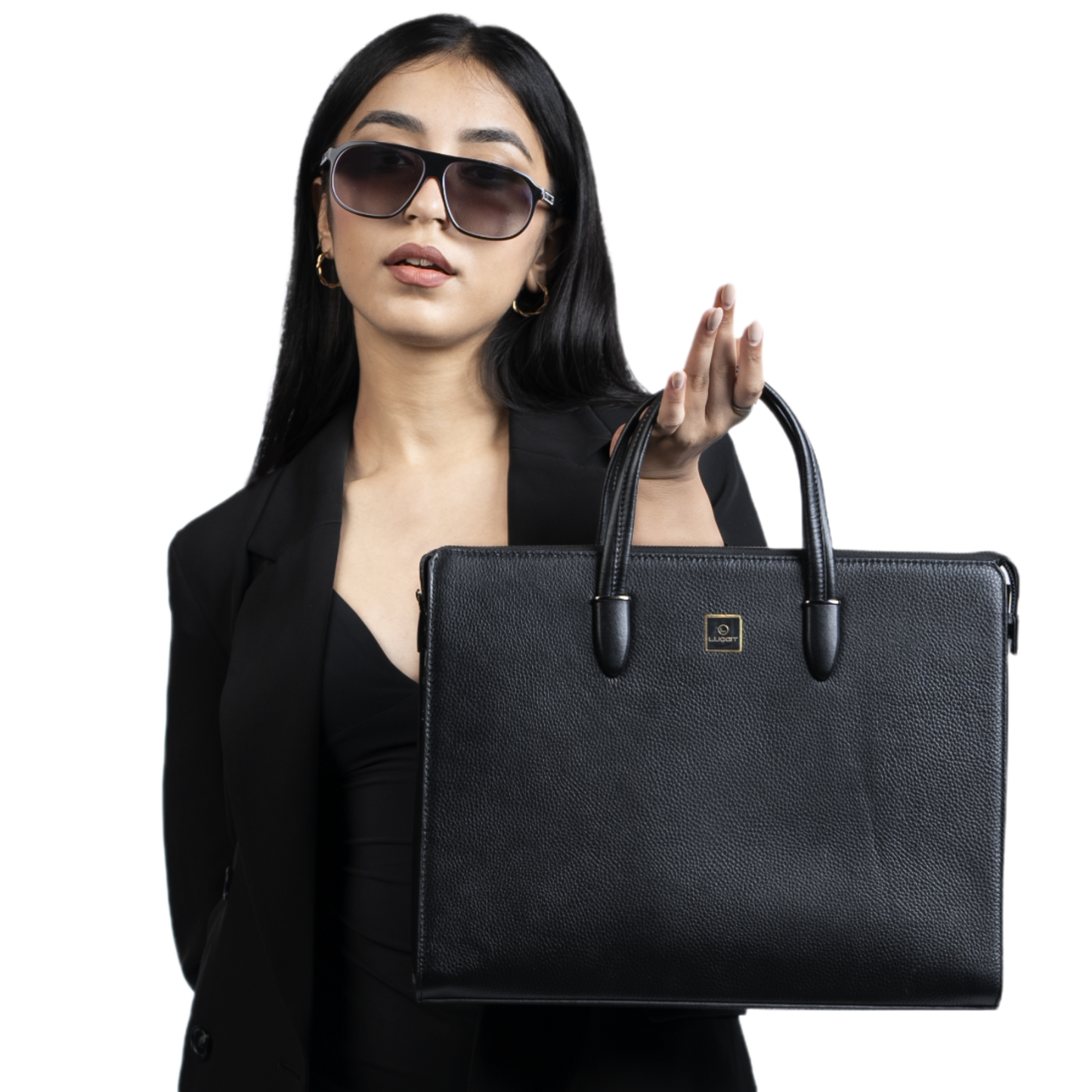 Woman holding a black briefcase against a white background
