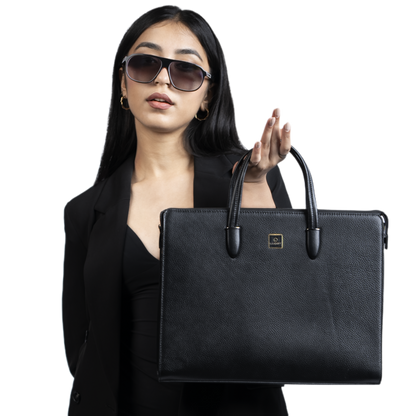 Woman holding a black briefcase against a white background