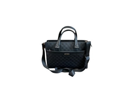 Black quilted handbag with a strap on a white background