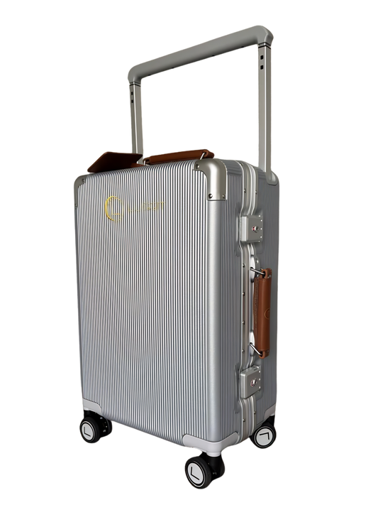 Silver suitcase with a handle and wheels on a white background