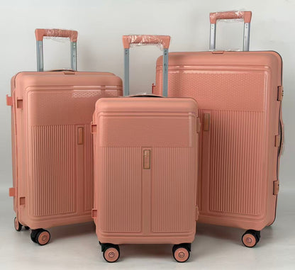 Three rose gold suitcases of different sizes on a light gray background