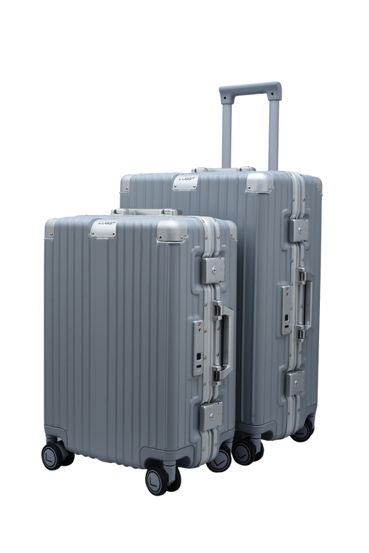 Two gray suitcases with wheels on a white background luggit