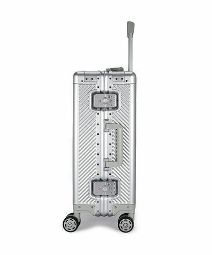 Silver suitcase with wheels and handle on a white background