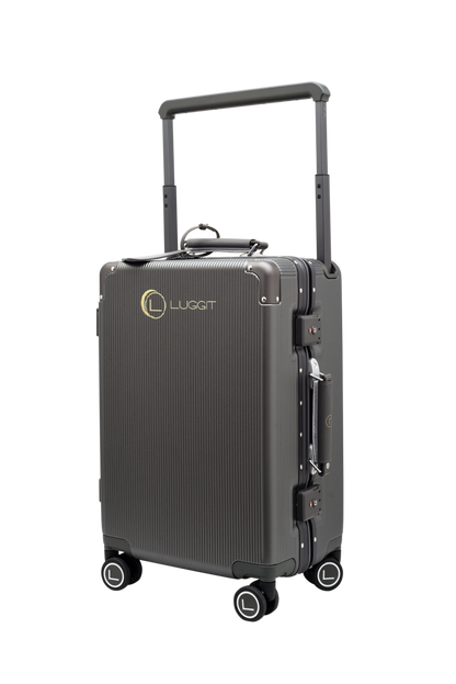 Black suitcase with wheels and handle on a white background, featuring the Luggit brand.