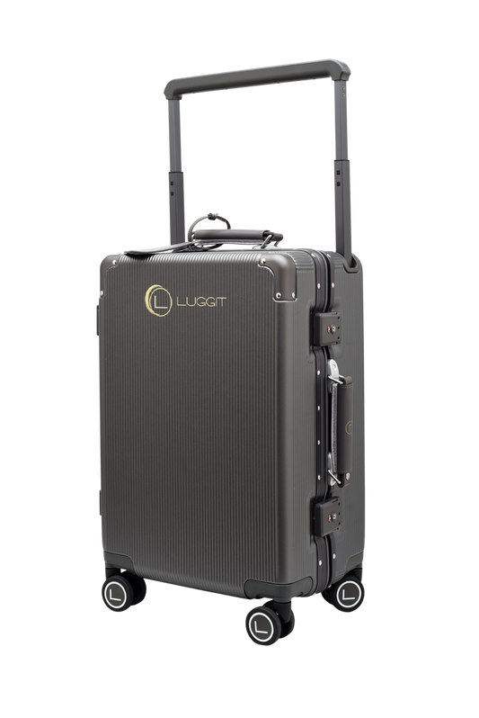 Black suitcase with wheels and handle on a white background, featuring the Luggit brand.