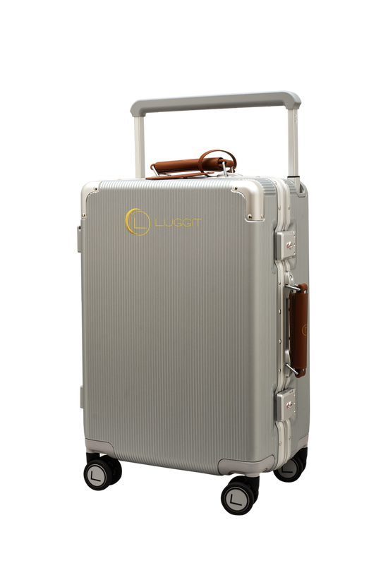 Silver suitcase with a handle and wheels on a white background