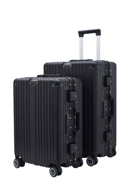 Two black suitcases with wheels on a white background