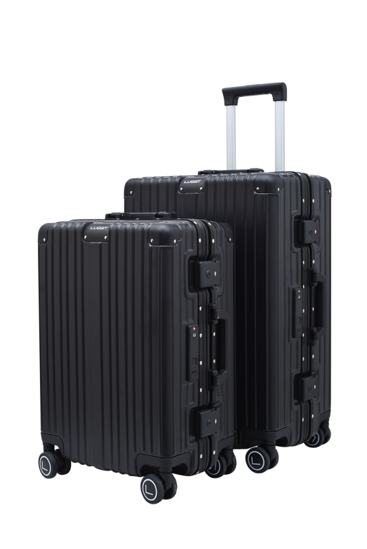 Two black suitcases with wheels on a white background