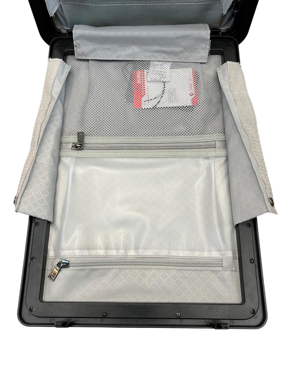 Open suitcase with interior compartments and a label on a white background