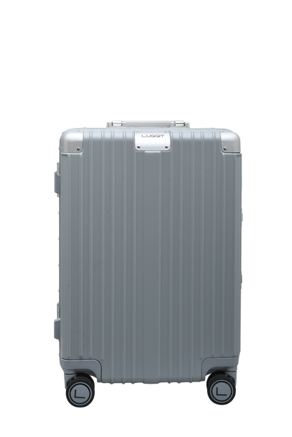 Silver suitcase with wheels on a white background luggit