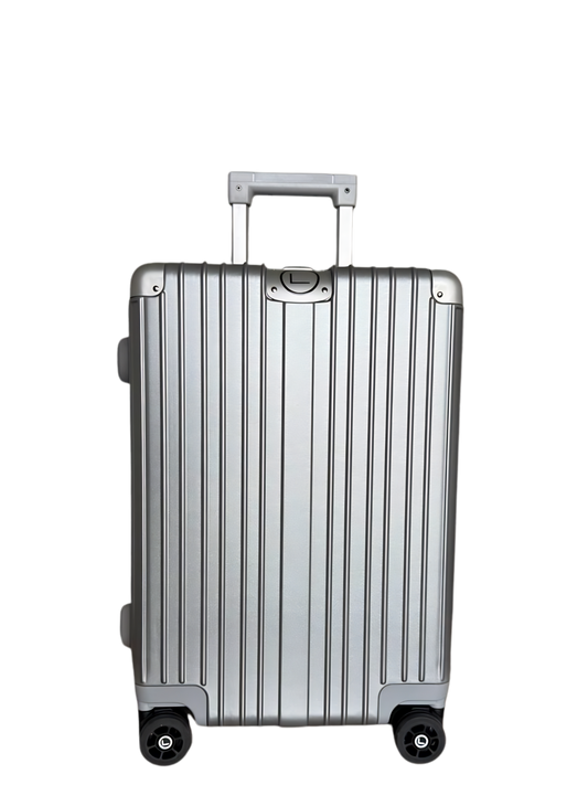 Silver suitcase with black wheels on a white background