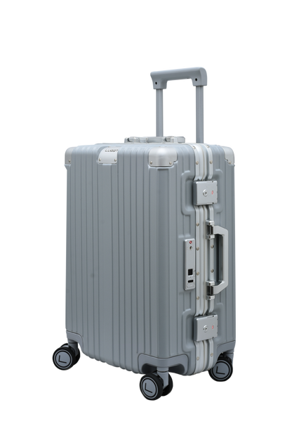 Silver suitcase with multiple handles and wheels on a white background luggit