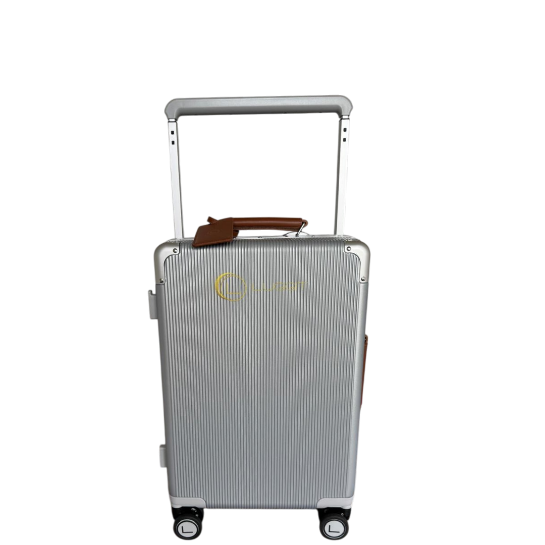 Silver suitcase with a handle on a white background
