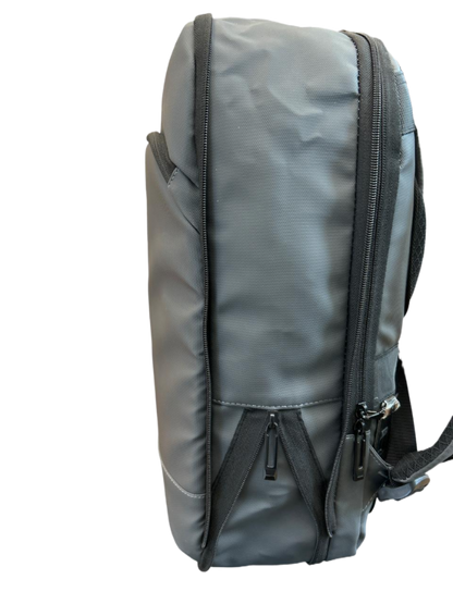Gray backpack with black zippers on a white background
