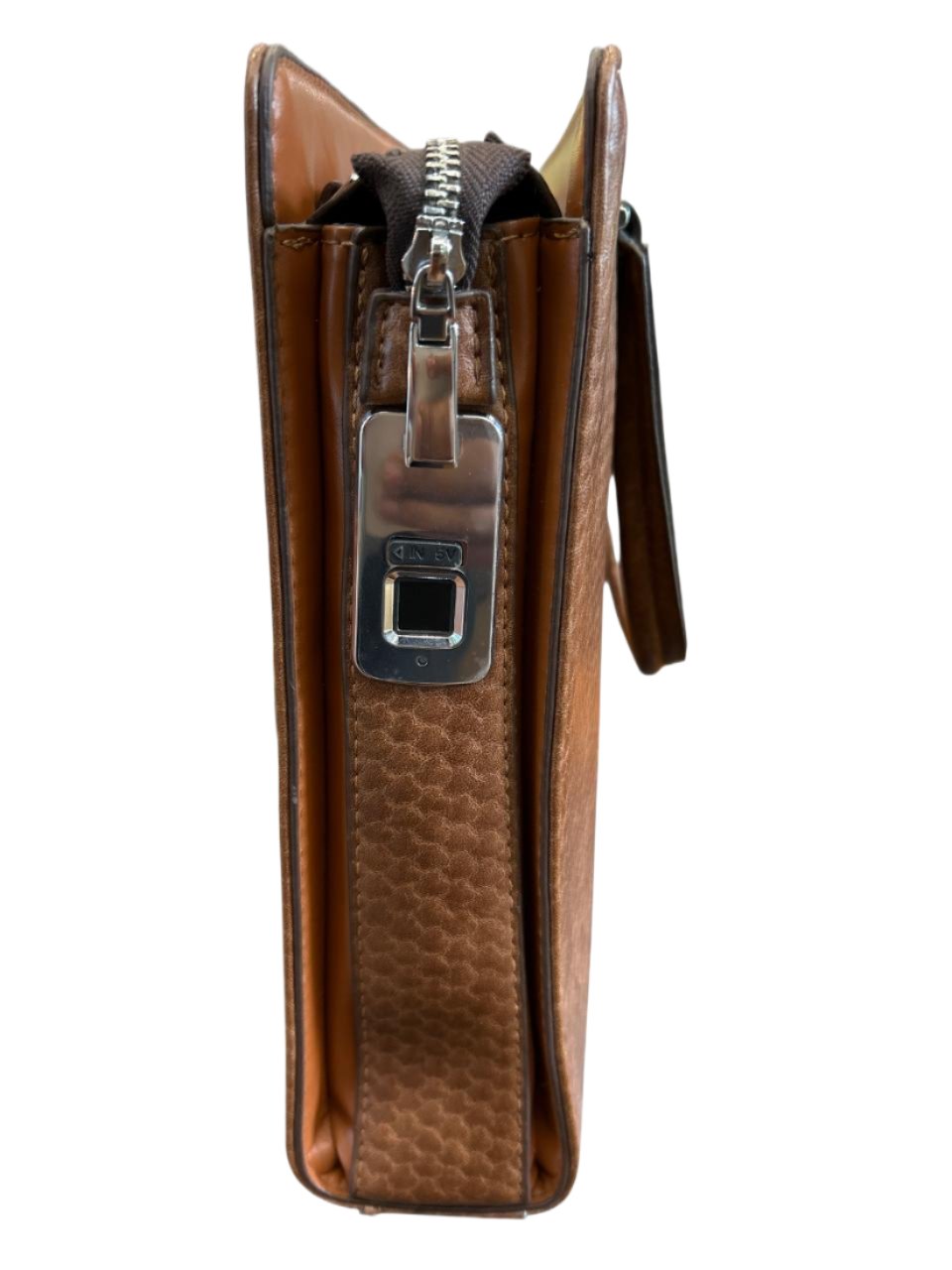 Brown leather wallet with a zipper on a luggit