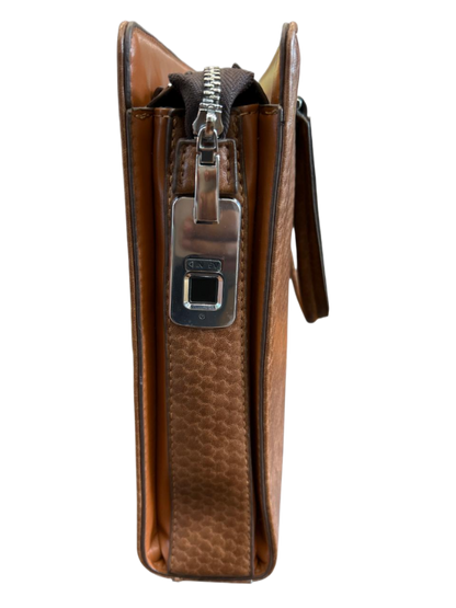 Brown leather wallet with a zipper on a luggit