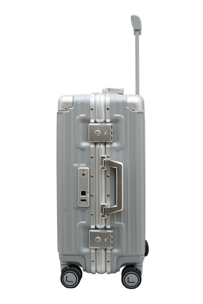 Silver suitcase with wheels and handle on a white background luggit