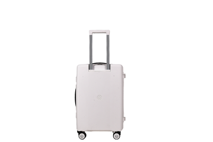 A light pink hard-shell rolling suitcase with an extended silver telescopic handle and four spinner wheels, shown against a plain white background.