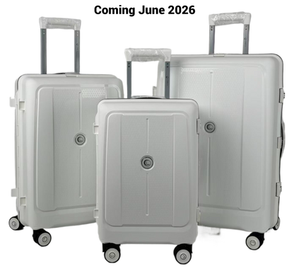 Set of three gray suitcases with 'Coming June 2026' text on a white background
