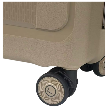 Close-up of a beige suitcase wheel on a white background